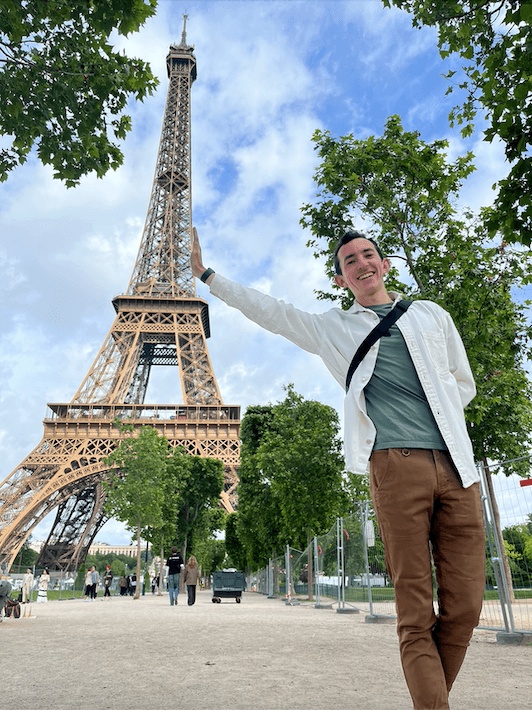 Photo of me in Paris, leaning against the either tower